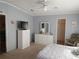 Bedroom with an entertainment area, closet and connected bathroom creating a luxurious Primary suite at 3114 Briar St. St, Wesley Chapel, FL 33543