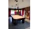 Community billiard room with a large pool table and vintage accents at 3114 Briar St. St, Wesley Chapel, FL 33543
