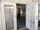 Open doorway revealing a cozy living space with neutral tones at 3114 Briar St. St, Wesley Chapel, FL 33543