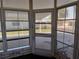 Screened-in porch providing serene views of the surrounding community at 3114 Briar St. St, Wesley Chapel, FL 33543