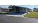 Single-story home with covered parking and manicured lawn at 3114 Briar St. St, Wesley Chapel, FL 33543