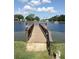 View of the wooden pier leading to the community lake at 3114 Briar St. St, Wesley Chapel, FL 33543