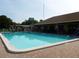 Community pool with covered seating area at 3114 Briar St. St, Wesley Chapel, FL 33543