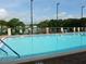 Community pool with view of lake and docks at 3114 Briar St. St, Wesley Chapel, FL 33543