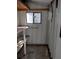 View of the interior of the shed with shelving, window, and storage for tools at 3114 Briar St. St, Wesley Chapel, FL 33543
