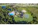 Aerial view of the community clubhouse, pool, playground, and recreational area at 32203 Wenlock Loop, Wesley Chapel, FL 33543