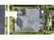 Overhead view of the home showcasing the roof, backyard pool, and patio at 32203 Wenlock Loop, Wesley Chapel, FL 33543