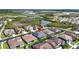 Aerial view of home in a neighborhood featuring a lake and community at 32203 Wenlock Loop, Wesley Chapel, FL 33543