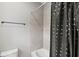 Bathroom featuring a shower/tub combination and a modern polka dot shower curtain at 32203 Wenlock Loop, Wesley Chapel, FL 33543