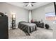 Comfortable bedroom featuring a ceiling fan, gray walls, and natural light at 32203 Wenlock Loop, Wesley Chapel, FL 33543