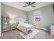 Charming bedroom with bright decor, carpet, and a window providing natural light at 32203 Wenlock Loop, Wesley Chapel, FL 33543