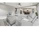 Open concept living room featuring tile floors, recessed lighting, and comfortable seating at 32203 Wenlock Loop, Wesley Chapel, FL 33543