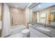 Clean bathroom featuring a shower over tub with tile surround and granite vanity at 36750 Us 19 N Hwy # 18-210, Palm Harbor, FL 34684
