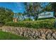 The Innisbrook Resort and Golf Club sign is displayed over a stone retaining wall at 36750 Us 19 N Hwy # 18-210, Palm Harbor, FL 34684