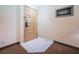 Entryway with light-colored door, tiled floor, neutral walls, and carpet flooring nearby at 36750 Us 19 N Hwy # 18-210, Palm Harbor, FL 34684