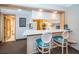 Charming kitchen with breakfast bar and modern white countertops at 36750 Us 19 N Hwy # 18-210, Palm Harbor, FL 34684