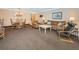 Spacious living room with dining area, comfortable seating, and ample natural light at 36750 Us 19 N Hwy # 18-210, Palm Harbor, FL 34684