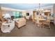 Spacious living room with dining area, comfortable seating, and great natural light at 36750 Us 19 N Hwy # 18-210, Palm Harbor, FL 34684