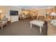 Cozy living room features open layout with dining area and updated kitchen at 36750 Us 19 N Hwy # 18-210, Palm Harbor, FL 34684