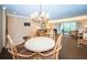 Inviting living room with comfortable seating and sliding glass doors to the outside balcony at 36750 Us 19 N Hwy # 18-210, Palm Harbor, FL 34684