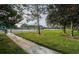 Multiple tennis courts offer recreation opportunities for residents and guests in a lush, green environment at 36750 Us 19 N Hwy # 18-210, Palm Harbor, FL 34684