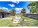 Picture of a beautiful backyard featuring lush green grass, stone walkways and garden beds at 4110 Summerdale Dr, Tampa, FL 33624