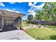 Large backyard with a screened-in patio and a beautiful lawn, perfect for outdoor activities and relaxation at 4110 Summerdale Dr, Tampa, FL 33624