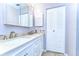 Bathroom boasts a dual sink vanity with modern fixtures, a framed mirror, and a neutral color scheme at 4110 Summerdale Dr, Tampa, FL 33624