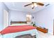 Bedroom featuring a comfortable bed, ceiling fan, and an ensuite bathroom at 4110 Summerdale Dr, Tampa, FL 33624