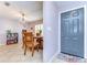 Dining area featuring a round table, wooden chairs, and a neutral color scheme at 4110 Summerdale Dr, Tampa, FL 33624