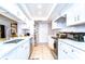 Updated kitchen featuring modern white cabinets, quartz countertops, and stainless steel appliances at 4110 Summerdale Dr, Tampa, FL 33624