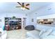 Open living room with tile flooring, a sectional sofa, and access to the kitchen at 4110 Summerdale Dr, Tampa, FL 33624