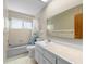 Bathroom featuring vanity, bathtub and shower combination with white tiles at 6470 28Th N Ter, St Petersburg, FL 33710