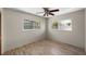 Bedroom with wood-look floors, ceiling fan and windows with outdoor views at 6470 28Th N Ter, St Petersburg, FL 33710