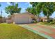 Charming single-story home with a two-car garage, manicured lawn, and mature trees offering curb appeal at 6470 28Th N Ter, St Petersburg, FL 33710