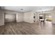 Bright, open living room features wood flooring, neutral walls, and seamless transition to outdoor living space at 6470 28Th N Ter, St Petersburg, FL 33710
