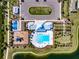 Overhead view of community pool, playground, and other amenities including tennis and parking at 659 Sunlit Coral St, Ruskin, FL 33570