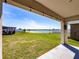 Enjoy outdoor living with a spacious backyard, patio, and serene lake views at 659 Sunlit Coral St, Ruskin, FL 33570