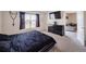 Comfortable bedroom featuring a large bed, modern dresser, and view from the bright window at 659 Sunlit Coral St, Ruskin, FL 33570