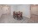 Cozy dining room featuring tile floors and a classic wooden table with seating for four at 659 Sunlit Coral St, Ruskin, FL 33570