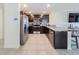Updated kitchen with stainless steel appliances, granite countertops, and a convenient breakfast bar at 659 Sunlit Coral St, Ruskin, FL 33570