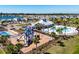 Community playground and pool area with lakeside views at 659 Sunlit Coral St, Ruskin, FL 33570