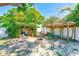 Charming backyard retreat with a fire pit, pergola, and cozy seating, creating an inviting outdoor oasis at 700 16Th Nw St, Largo, FL 33770