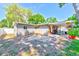 Spacious backyard featuring a charming covered patio, perfect for outdoor gatherings and relaxation at 700 16Th Nw St, Largo, FL 33770