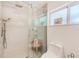 Modern bathroom with glass-enclosed shower, white subway tile, and updated fixtures at 700 16Th Nw St, Largo, FL 33770