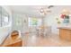 Bright dining area with tiled floors and a view of the front yard at 700 16Th Nw St, Largo, FL 33770