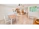 Spacious dining room seamlessly connects to an open kitchen area at 700 16Th Nw St, Largo, FL 33770