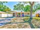 This well-maintained home boasts a cozy exterior and mature trees at 700 16Th Nw St, Largo, FL 33770