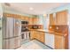 Bright kitchen features updated stainless steel appliances and plenty of cabinet space at 700 16Th Nw St, Largo, FL 33770