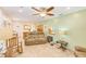 View of the open living room with bar seating and a kitchen pass-through at 700 16Th Nw St, Largo, FL 33770